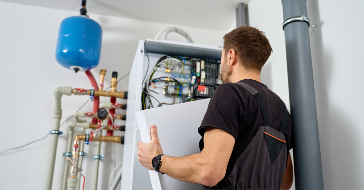 A HVAC professional inspecting a heating system