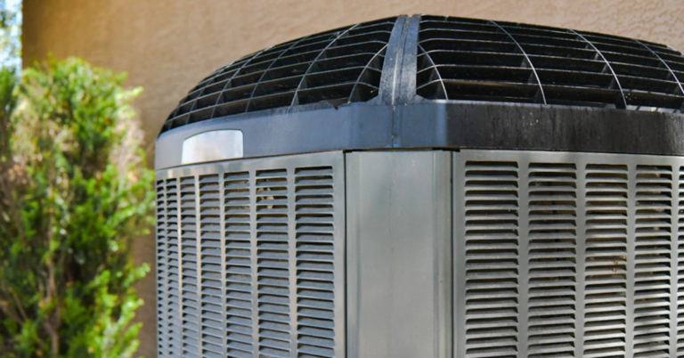 Large AC unit against the exterior of a home.