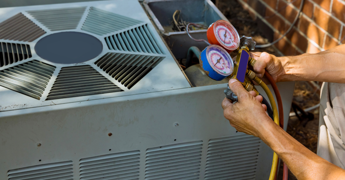 An AC tune-up being performed by an HVAC professional