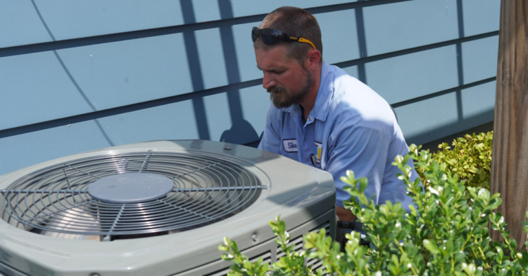 Shane from Holtzople is installing an AC unit.