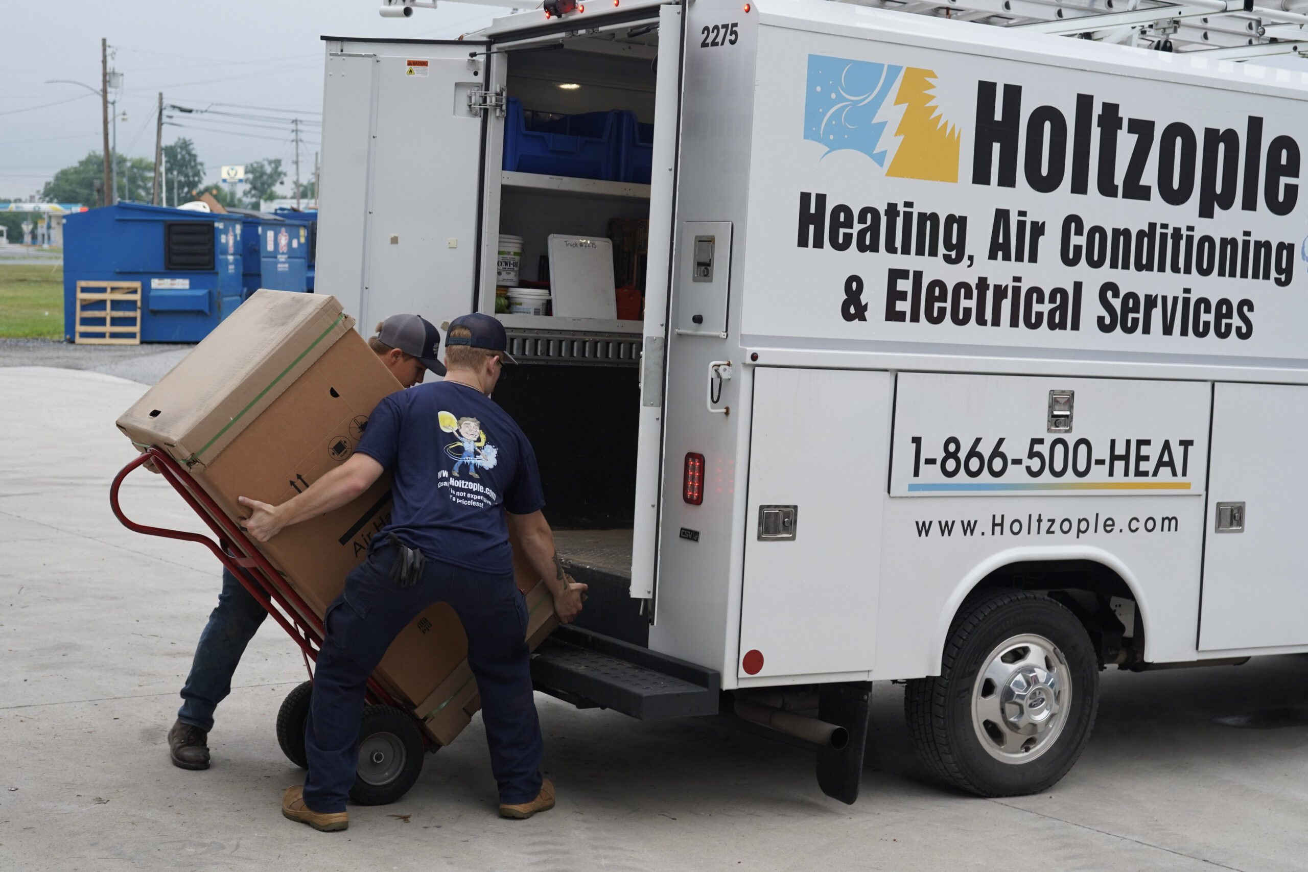 Holtzople team members loading the Holtzople van